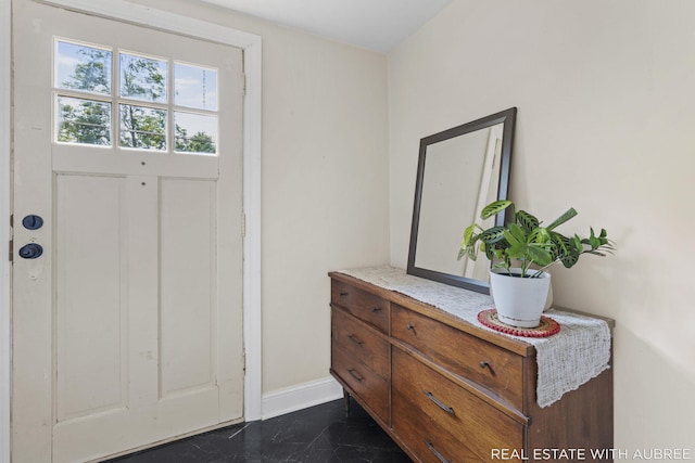537 Graafschap Rd, Holland, MI 49423 - foyer entrance featuring baseboards and dark marble finish flooring
