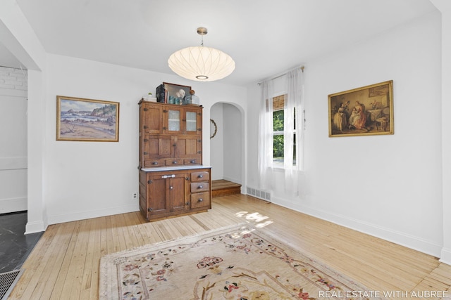 537 Graafschap Rd, Holland, MI 49423 - living area with light wood-type flooring and arched walkways