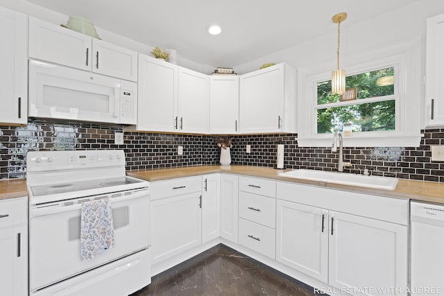 537 Graafschap Rd, Holland, MI 49423 - kitchen featuring white appliances, tasteful backsplash, white cabinetry, pendant lighting, and recessed lighting