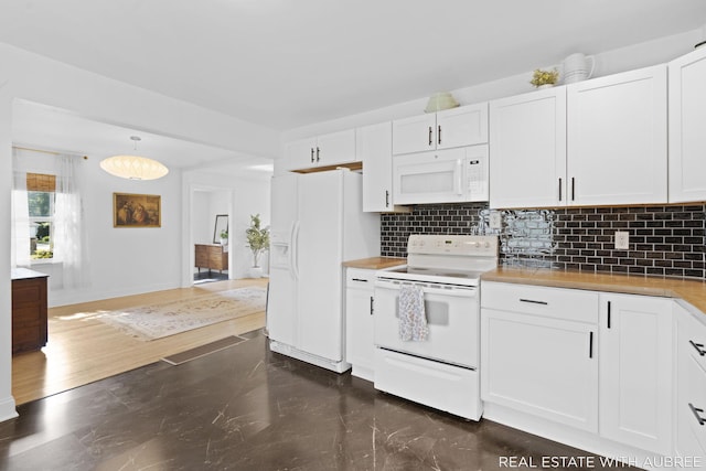 537 Graafschap Rd, Holland, MI 49423 - kitchen with white appliances, white cabinets, and backsplash