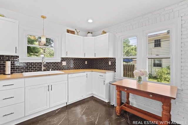 537 Graafschap Rd, Holland, MI 49423 - kitchen with white dishwasher, decorative backsplash, wood counters, dark marble finish floors, and white cabinetry