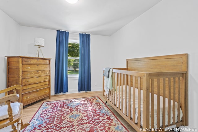 537 Graafschap Rd, Holland, MI 49423 - bedroom featuring wood finished floors and baseboards