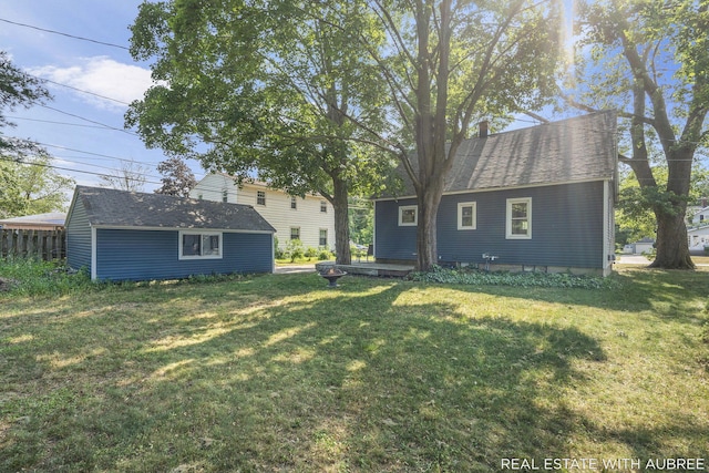 537 Graafschap Rd, Holland, MI 49423 - rear view of house with an outbuilding and a lawn