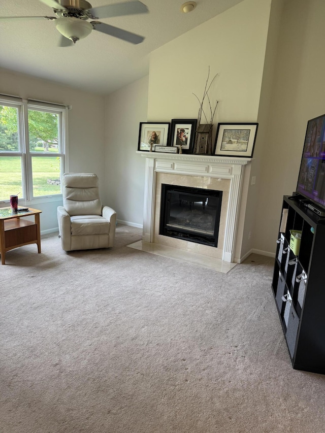 233 Hatch Ave, Coldwater, MI 49036 - living area featuring carpet, lofted ceiling, a fireplace, and a ceiling fan