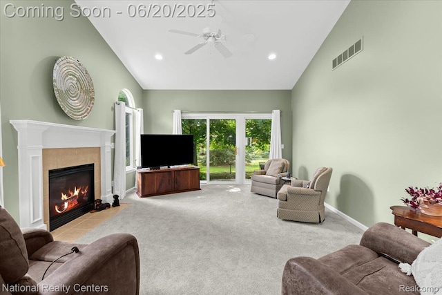 332 Asbury Ct, Highland, MI 48357 - living area featuring a ceiling fan, carpet floors, a tiled fireplace, recessed lighting, and high vaulted ceiling