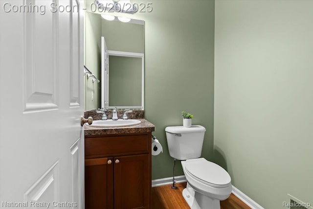 332 Asbury Ct, Highland, MI 48357 - bathroom with vanity and wood finished floors