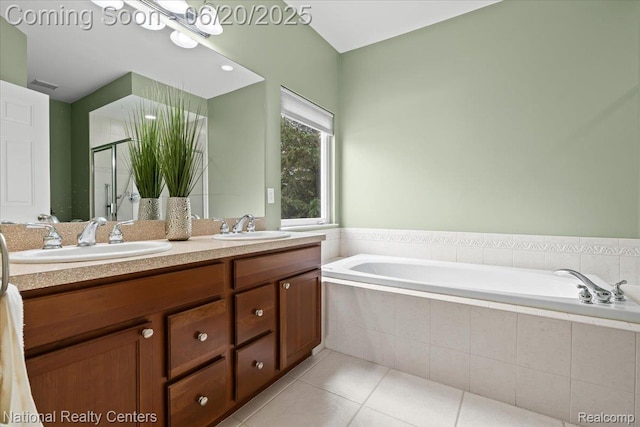 332 Asbury Ct, Highland, MI 48357 - full bath featuring a garden tub, double vanity, a shower stall, and tile patterned floors