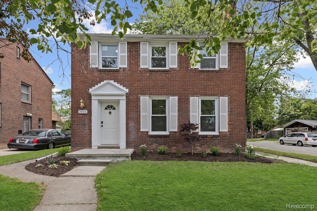 3900 Somerset Ave, Grosse Pointe Woods, MI 48224 - colonial house with a front lawn and brick siding