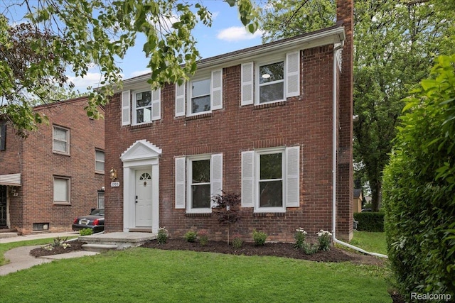 3900 Somerset Ave, Grosse Pointe Woods, MI 48224 - view of front of home with a front lawn, brick siding, and a chimney