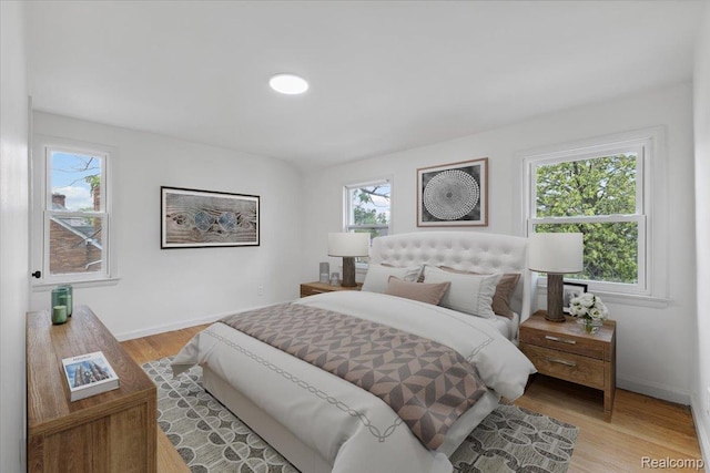 3900 Somerset Ave, Grosse Pointe Woods, MI 48224 - bedroom with light wood-style flooring and baseboards