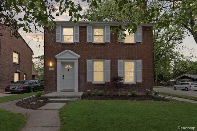 3900 Somerset Ave, Grosse Pointe Woods, MI 48224 - colonial inspired home with a front lawn and brick siding
