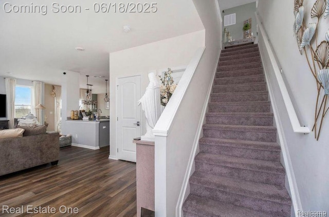 8757 Grove St, Washington, MI 48094 - staircase with wood finished floors and baseboards