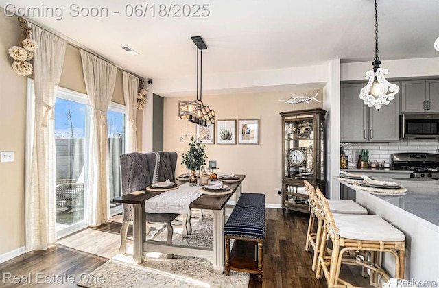 8757 Grove St, Washington, MI 48094 - dining room with dark wood-style floors and baseboards