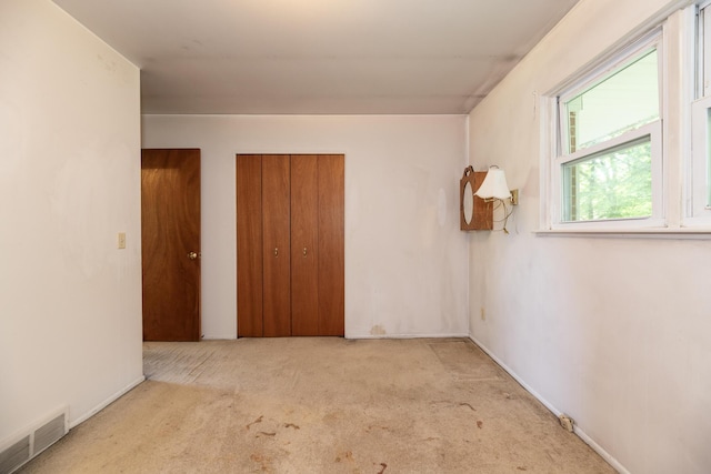 10229 N 22nd St, Plainwell, MI 49080 - unfurnished bedroom featuring carpet and a closet