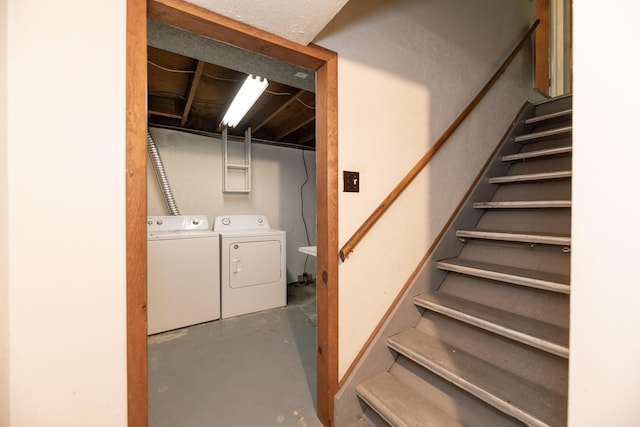 10229 N 22nd St, Plainwell, MI 49080 - below grade area featuring washing machine and clothes dryer and stairway