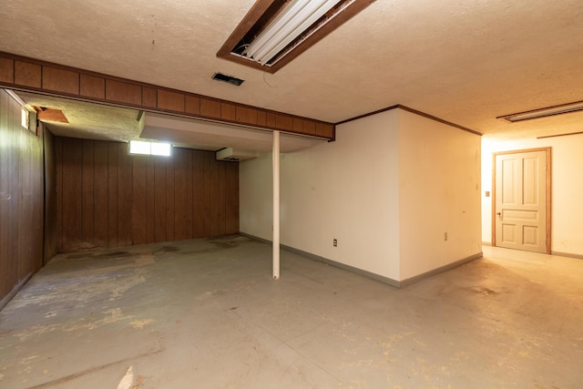 10229 N 22nd St, Plainwell, MI 49080 - finished basement with a textured ceiling and wooden walls