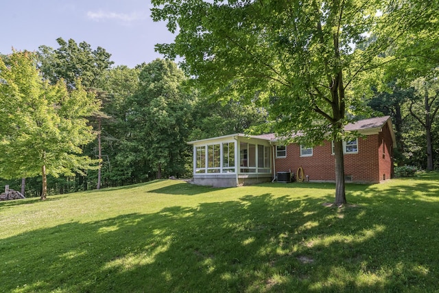 10229 N 22nd St, Plainwell, MI 49080 - view of green lawn featuring a sunroom