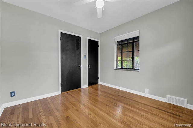 5500 Harvard Rd, Detroit, MI 48224 - unfurnished bedroom with wood finished floors and a ceiling fan
