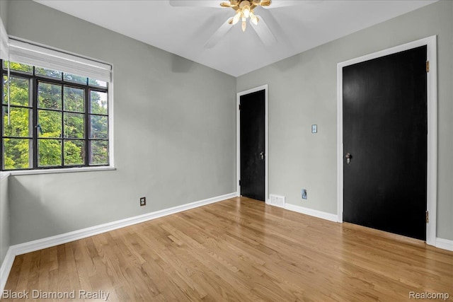 5500 Harvard Rd, Detroit, MI 48224 - unfurnished bedroom with light wood finished floors and ceiling fan