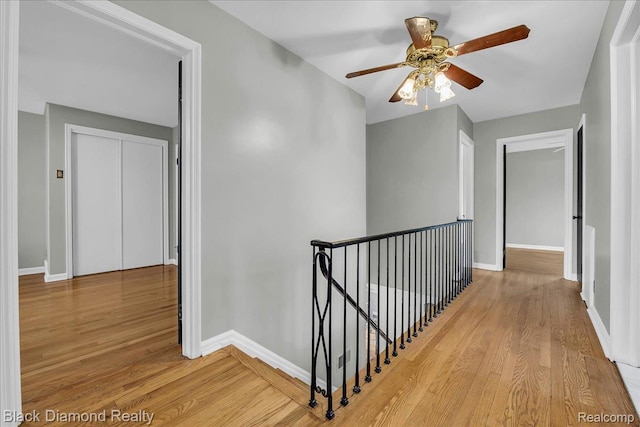 5500 Harvard Rd, Detroit, MI 48224 - corridor with an upstairs landing and light wood-style floors