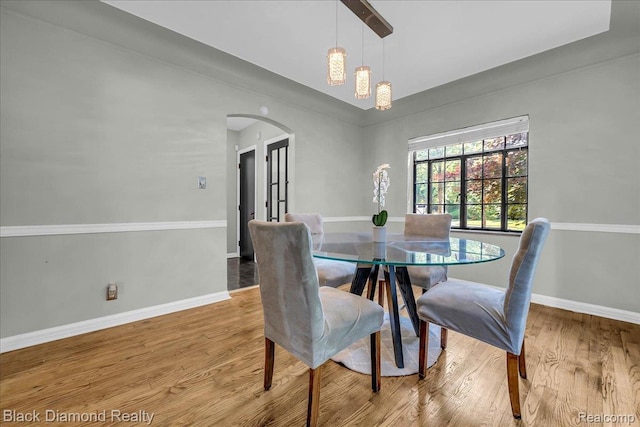 5500 Harvard Rd, Detroit, MI 48224 - dining area featuring arched walkways and wood finished floors