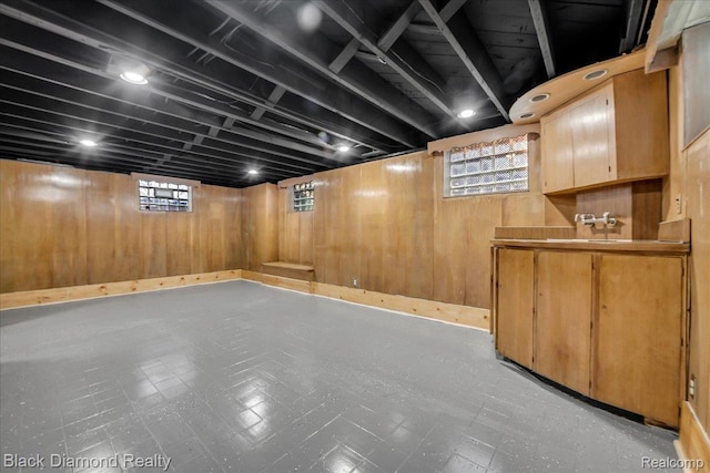 5500 Harvard Rd, Detroit, MI 48224 - basement with tile patterned floors and wood walls