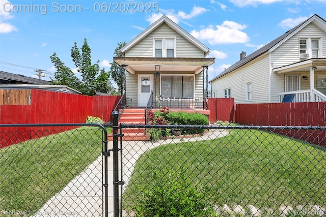 107 Pine St, River Rouge, MI 48218 - shotgun-style home with covered porch, a gate, a fenced front yard, and cooling unit