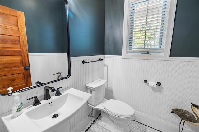 4679-4681 Forest Ridge Dr, Holland, MI 49423 - half bathroom featuring wainscoting and tile patterned floors