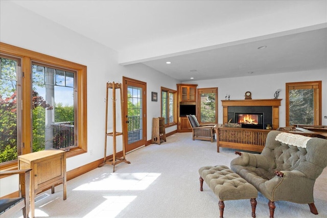 4679-4681 Forest Ridge Dr, Holland, MI 49423 - living room with light colored carpet, a glass covered fireplace, and recessed lighting