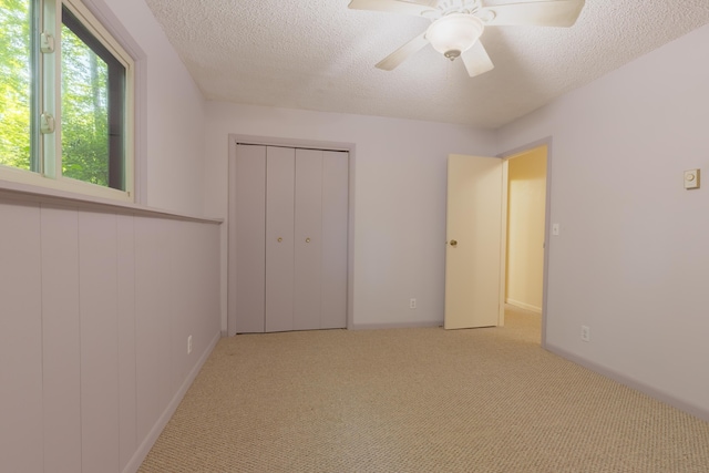 10096 S S Ave W, Michigan, MI 49071 - unfurnished bedroom with a textured ceiling, carpet floors, a ceiling fan, and a closet