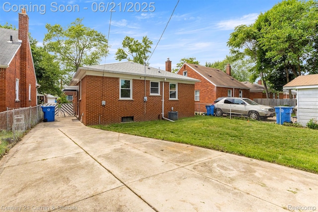 8276 Riverview St, Dearborn Heights, MI 48127 - back of house featuring brick siding and driveway