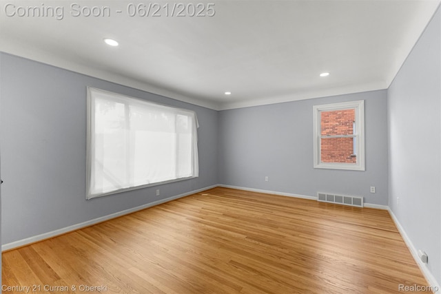 8276 Riverview St, Dearborn Heights, MI 48127 - spare room with wood finished floors and recessed lighting