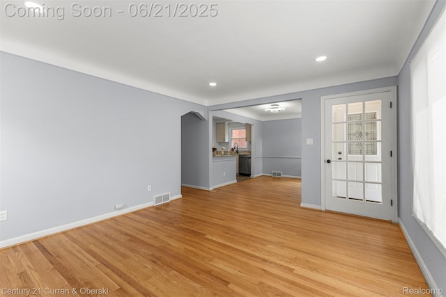 8276 Riverview St, Dearborn Heights, MI 48127 - unfurnished living room with light wood-style flooring and recessed lighting