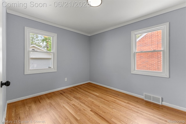 8276 Riverview St, Dearborn Heights, MI 48127 - unfurnished room with light wood-style floors and ornamental molding