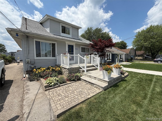 37805 Maplehill St, Harrison Township, MI 48045 - view of front facade with a front yard and a shingled roof