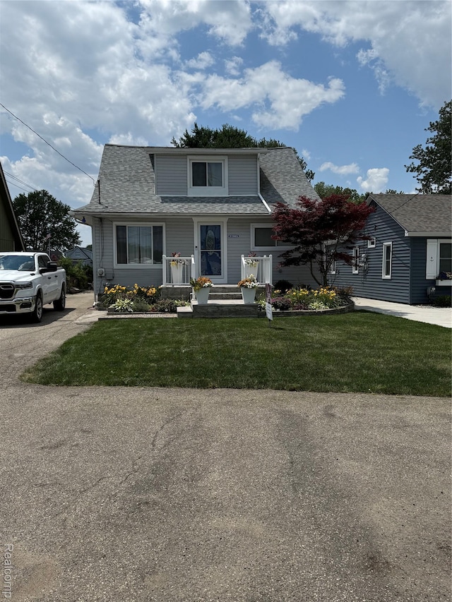 37805 Maplehill St, Harrison Township, MI 48045 - view of front facade featuring a shingled roof and a front lawn