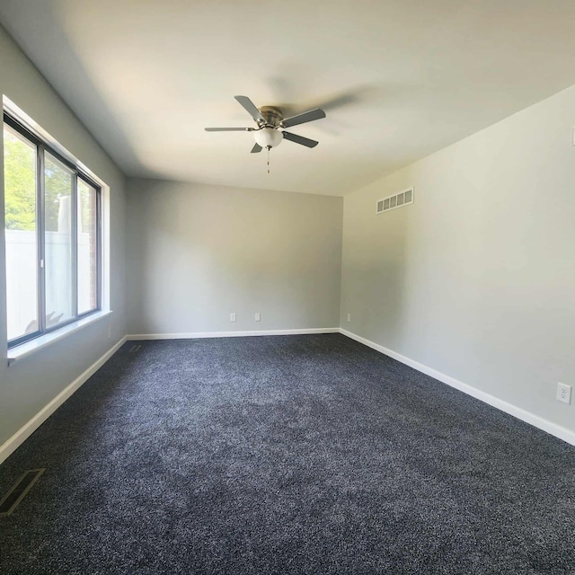 4536 Westbrook Dr Unit 46, Jackson, MI 49201 - empty room with ceiling fan and dark carpet