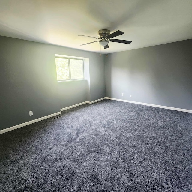 4536 Westbrook Dr Unit 46, Jackson, MI 49201 - spare room with a ceiling fan and dark colored carpet