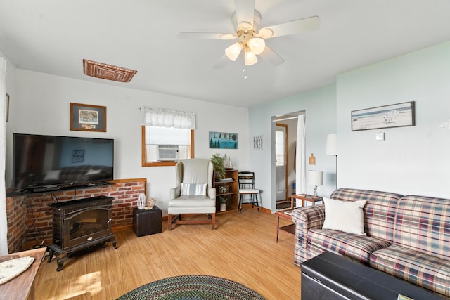 17295 Stevens Forest Lake St, Cassopolis, MI 49031 - living room featuring wood finished floors, a ceiling fan, and cooling unit