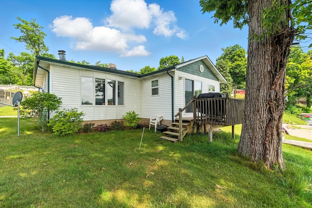 17295 Stevens Forest Lake St, Cassopolis, MI 49031 - back of house with a wooden deck, a yard, and a chimney