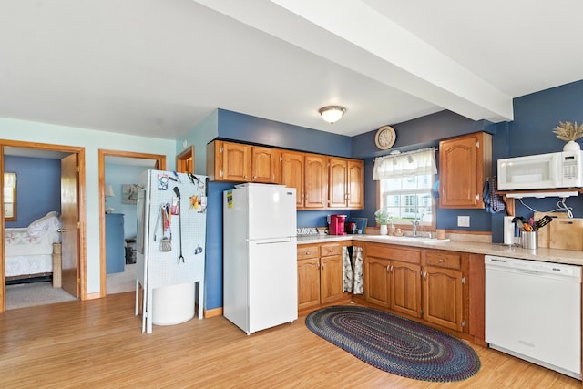 17295 Stevens Forest Lake St, Cassopolis, MI 49031 - kitchen featuring white appliances, light wood finished floors, light countertops, and brown cabinets