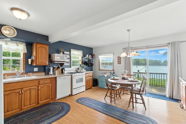 17295 Stevens Forest Lake St, Cassopolis, MI 49031 - kitchen featuring white appliances, light wood-type flooring, light countertops, a chandelier, and beam ceiling