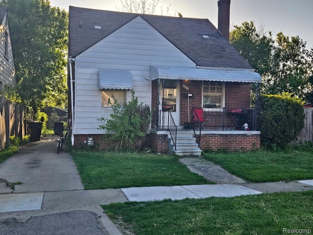 6367 Abington Ave, Detroit, MI 48228 - bungalow-style home with covered porch, a chimney, and a shingled roof