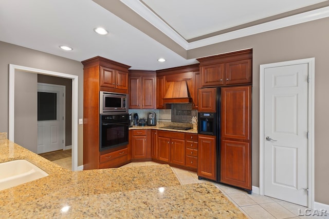 3054 Windmill Dr, Adrian, MI 49221 - kitchen featuring black appliances, custom range hood, backsplash, light tile patterned floors, and light stone countertops