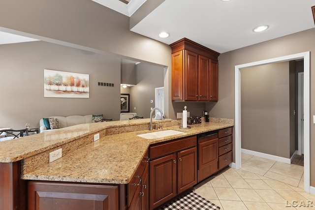3054 Windmill Dr, Adrian, MI 49221 - kitchen featuring a peninsula, light tile patterned floors, light stone counters, and recessed lighting