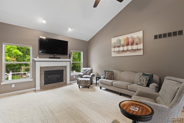 3054 Windmill Dr, Adrian, MI 49221 - living area featuring ceiling fan, plenty of natural light, carpet floors, high vaulted ceiling, and a fireplace