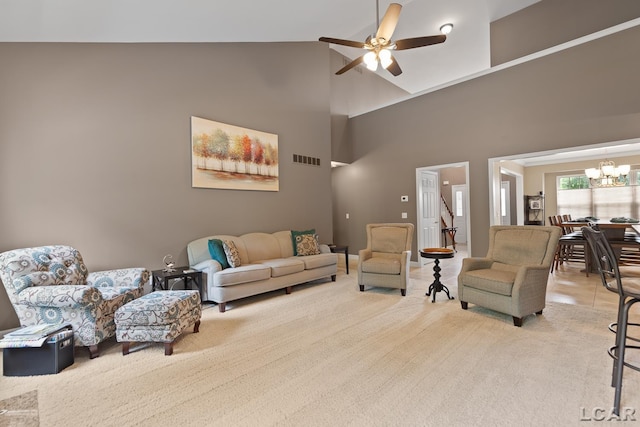 3054 Windmill Dr, Adrian, MI 49221 - living area featuring a ceiling fan, a chandelier, and high vaulted ceiling
