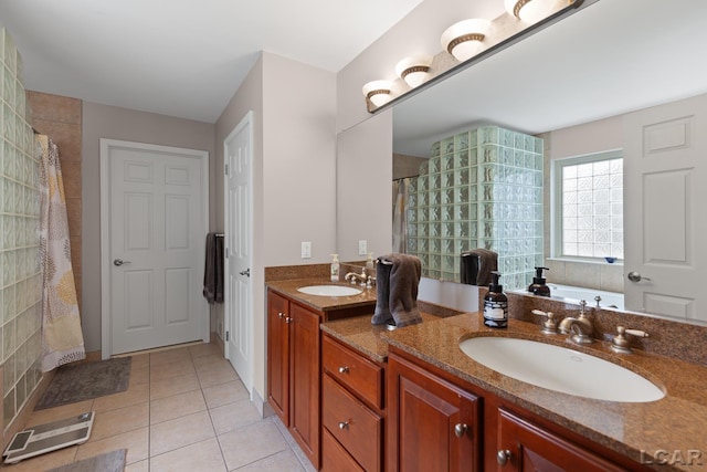 3054 Windmill Dr, Adrian, MI 49221 - full bath with double vanity, tiled shower, tile patterned flooring, and a tub to relax in