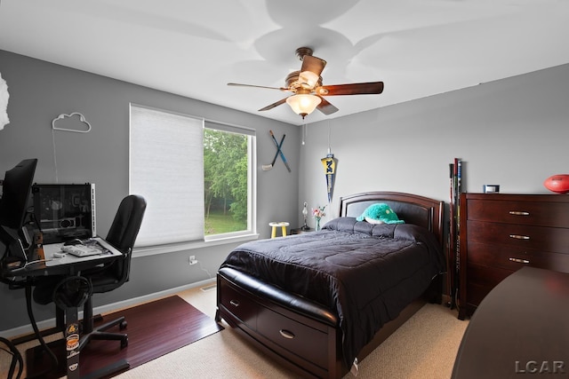 3054 Windmill Dr, Adrian, MI 49221 - bedroom featuring an office area, ceiling fan, and wood finished floors