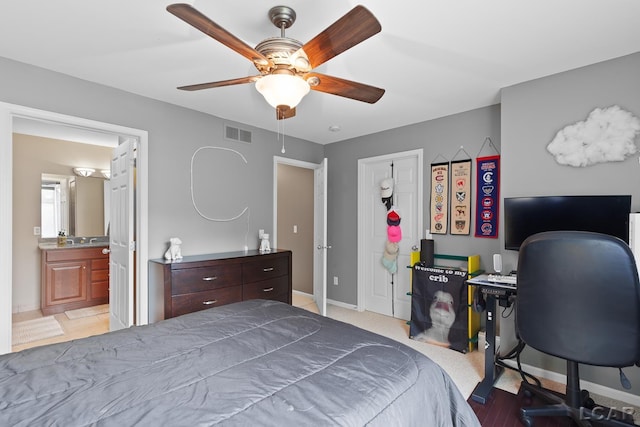 3054 Windmill Dr, Adrian, MI 49221 - bedroom featuring an office area, a ceiling fan, and connected bathroom